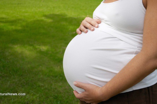 Pregnant-Woman-Caressing-Her-Huge-Belly-At-Open-Air