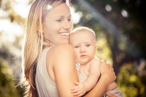 Smiling-Mother-Baby-Park-e1455624812486-300x200